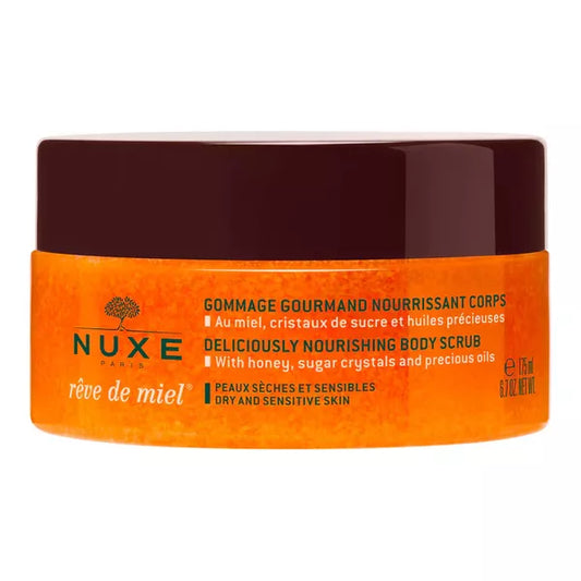 Nuxe Rêve de Miel nourishing body scrub in a jar, enriched with honey, sugar crystals, and precious oils for dry, sensitive skin.